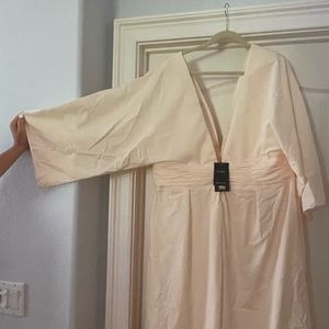 New cream colored jumpsuit. Never worn size 20.